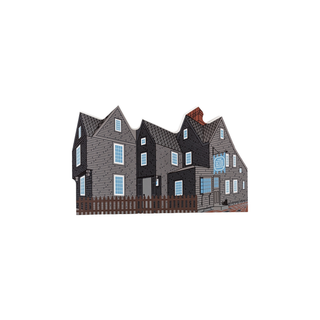 3/4" wooden replica with an illustration of a houses with a brown fence on a white background