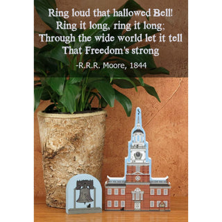 3/4" thick wooden cutout of Independence Hall and liberty bell with a quote by R.R. Moore on a wooden surface.