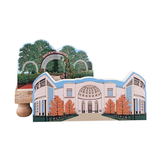wooden replica of a building with trees and an archway on a white background