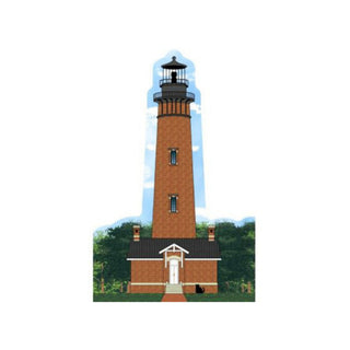 3/4" wooden replica with an illustration  of a brick lighthouse with a blue sky and green trees in the background