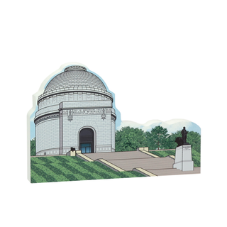 3/4" thick wooden cutout  of a mausoleum with a statue on a white background