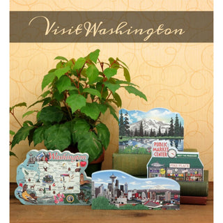 Set of Washington-themed decorative 3/4" thick wooden cutouts sitting on a wooden surface with a plant in the background.