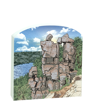 3/4" thick wooden replica with an Illustration of stone pillars with a scenic background