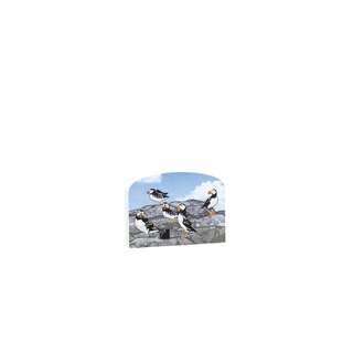 3/4" thick wooden figurine with puffins on a rocky outcrop against a blue sky