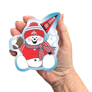 Hand holding a decorative wooden replica with a cartoon character wearing a red hat and holding a football, on a white background.