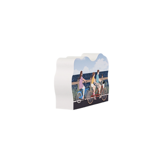 3/4" wooden replica with an illustration of  Three people riding bicycles on a scenic boardwalk with ocean view