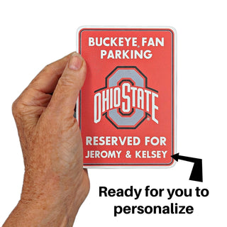 Hand holding a red Ohio State parking sign with customizable text on a white background