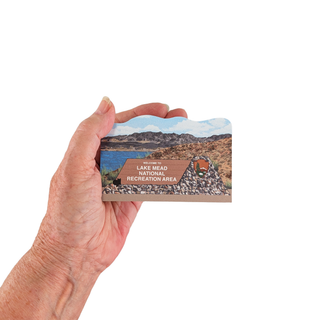 Hand holding a Lake Mead National Recreation Area  wooden replica 