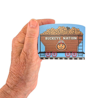Hand holding a 3/4" thick wooden replica with an illustration of a train car labeled 'Buckeye Nation' on a white background