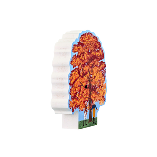 3/4" thick wooden replica with an illustration of an autumn tree with orange and red leaves, a blue sky, and a couple standing under the tree.
