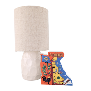Lamp with a textured beige shade and decorative 3/4" thick wooden Delaware map on a white background
