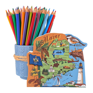 Colorful pencils in a blue holder with a decorative 3/4" thick wooden Maine-shaped figurine featuring state symbols.