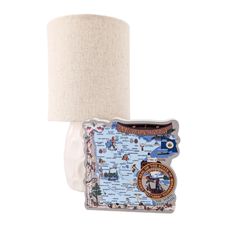Lamp with a 3/4" thick wooden map design on a white background 