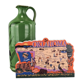Green ceramic jug next to a 3/4" thick wooden decorative Oklahoma map on a white background