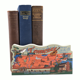 Three books with decorative spines and a colorful Tennessee-themed 3/4" thick wooden map on a white background.
