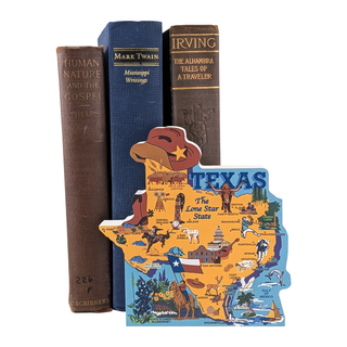 3/4" thick wooden Map of Texas with illustrations, placed on top of three books with visible titles.