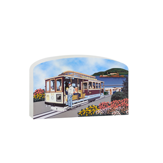 3/4" thick wooden Illustration of a cable car on a scenic route with flowers and mountains in the background.