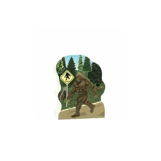 3/4" wooden replica with an illustration of a Sasquatch with a forest background and a Bigfoot warning sign.