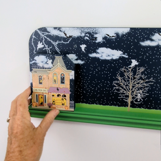 a house with a snowy night scene