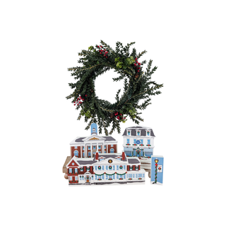 3/4" thick wooden illustrations of a Christmas town on display