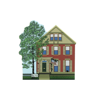 3/4" thick wooden cutout  of a two-story house with a tree and American flag on a white background