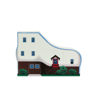 3/4" thick wooden cutout  of a house with a red door and blue windows on a white background