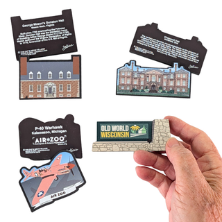 Four small souvenir-style magnets or bookmarks are shown on a white background, with one held in a person's hand. The set includes illustrated building and airplane designs with text panels, including visible text such as 'George Mason's Gurnee Hall', 'P-40 Warhawk', and 'Old World Wisconsin'.