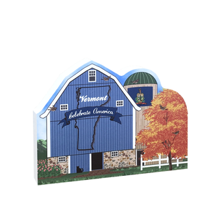 3/4" thick wooden cutout of of a blue barn with 'Vermont Celebrate America' text, trees, and birds.