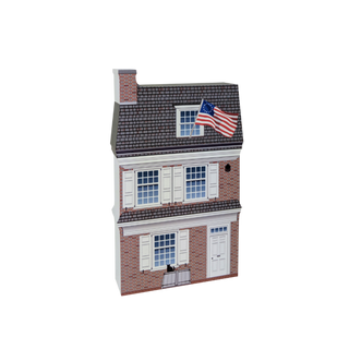 3/4" thick wooden cutout of a two-story house with an American flag on the roof against a white background