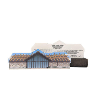 3/4" wooden replica with an illustration of a building with a white label on a white background
