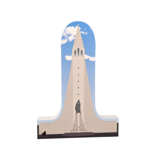 3/4" thick wooden replica with an Illustration of a tall, pointed church tower with a blue sky background
