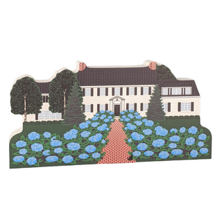 Wooden replica Illustration of a house with blue flowers and trees