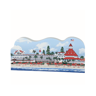 3/4" thick wooden Illustration of a beachfront resort with red roofs and palm trees on a white background