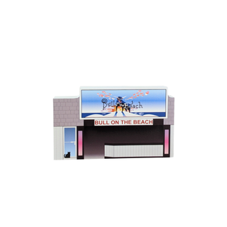 3/4" wooden replica with an illustration of a movie theater with 'Bull on the Beach' sign on a white background
