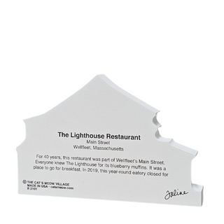 back of wooden replica with black text about The Lighthouse Restaurant on a white background
