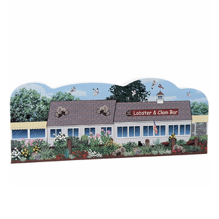 Wooden souvenir replica of a lobster and clam bar with a garden in front on a white background