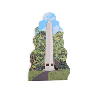 3/4" thick wooden cutout of Memorial monument surrounded by trees with a clear sky
