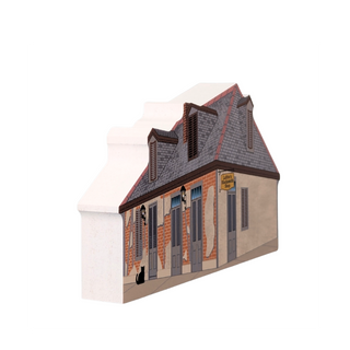 3/4" thick wooden illustration of a small building with a sign on a white background