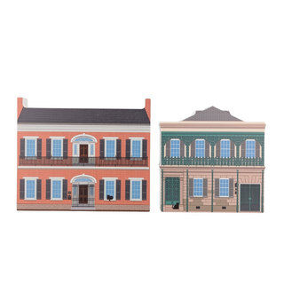 3/4" thick wooden illustrations of two colorful building models on a white background