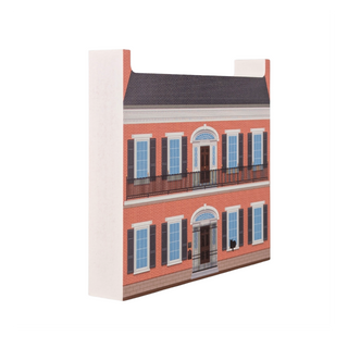3/4" thick wooden illustration of a two-story brick building with balconies and windows on a white background