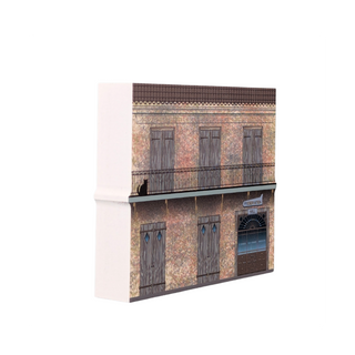 3/4" thick wooden illustration of a two-story building with balconies and a sign on a white background