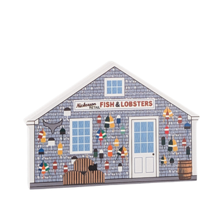 wooden replica with an illustration of a store called nickerson retail fish and lobster with fishing paraphernalia on the front