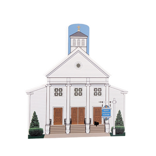 wooden replica with an Illustration of a church building with a steeple and 'Saint Francis Xavier' sign.