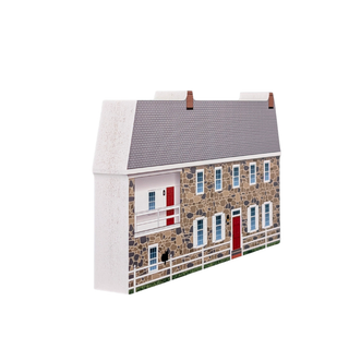 wooden replica with an illustration of a stone house with a gray roof on a white background