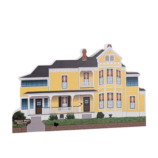 3/4" thick wooden cutout of a Yellow house with a black roof on a white background