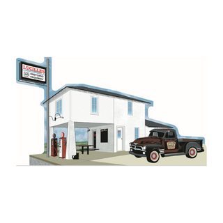 3/4" thick wooden cutout  of a gas station with a vintage truck and sign on a white background