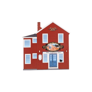 Red building with blue door and sign on a white background