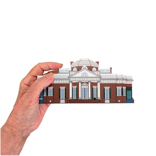 Hand holding a miniature 3/4" thick wooden model of a famous architectural building