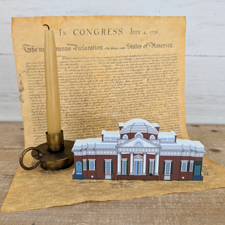 3/4" thick wooden Model of a building on a piece of paper with text, resembling the Declaration of Independence.