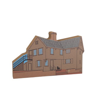 3/4" thick wooden model of a house with blue accents on a white background